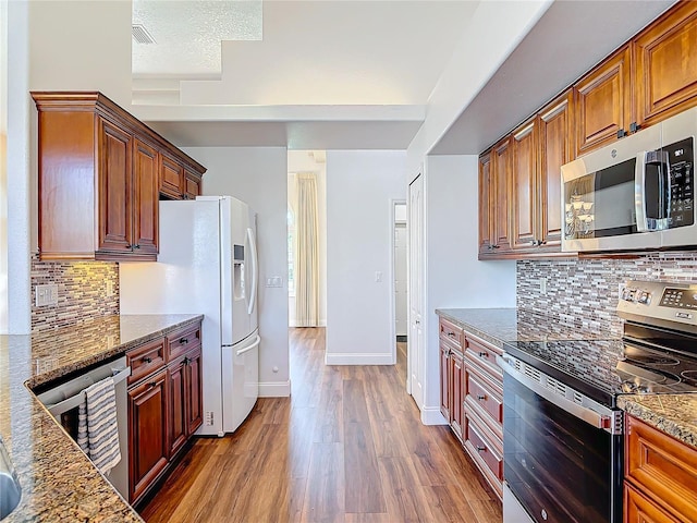 6456 Cypress Springs Pkwy, Port Orange, FL 32128 - kitchen with dark wood-type flooring, beverage cooler, stone countertops, tasteful backsplash, and appliances with stainless steel finishes