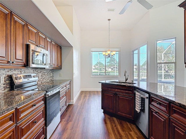 6456 Cypress Springs Pkwy, Port Orange, FL 32128 - kitchen featuring tasteful backsplash, visible vents, dark wood finished floors, stainless steel appliances, and a sink