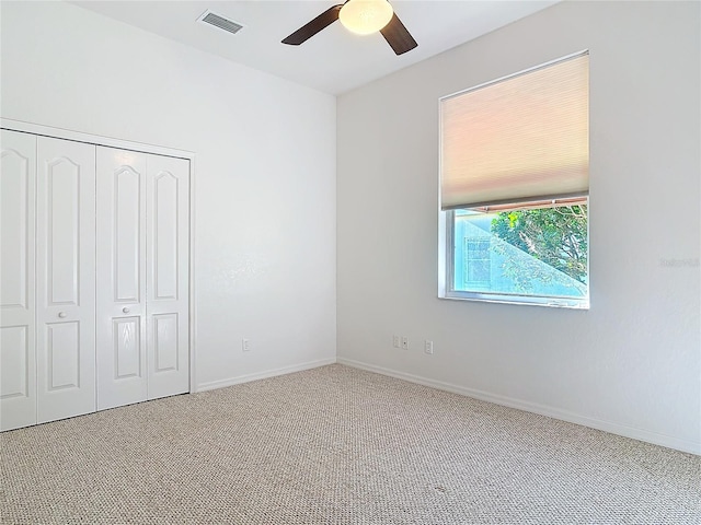 6456 Cypress Springs Pkwy, Port Orange, FL 32128 - unfurnished bedroom with visible vents, a closet, carpet flooring, baseboards, and ceiling fan