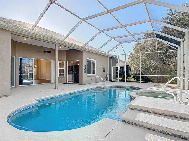 6456 Cypress Springs Pkwy, Port Orange, FL 32128 - outdoor pool featuring glass enclosure, a patio, and an in ground hot tub