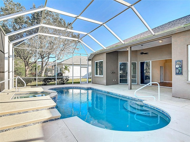 6456 Cypress Springs Pkwy, Port Orange, FL 32128 - view of pool featuring glass enclosure, a pool with connected hot tub, a ceiling fan, and a patio