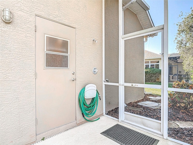 6456 Cypress Springs Pkwy, Port Orange, FL 32128 - view of exterior entry with stucco siding