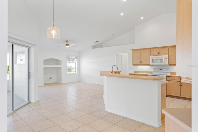 kitchen featuring a ceiling fan, white appliances, light countertops, and light tile patterned flooring