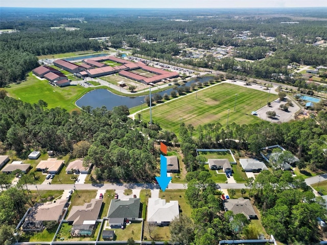 birds eye view of property featuring a water view and a residential view