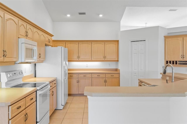 kitchen with light countertops, white appliances, light tile patterned floors, and light brown cabinetry