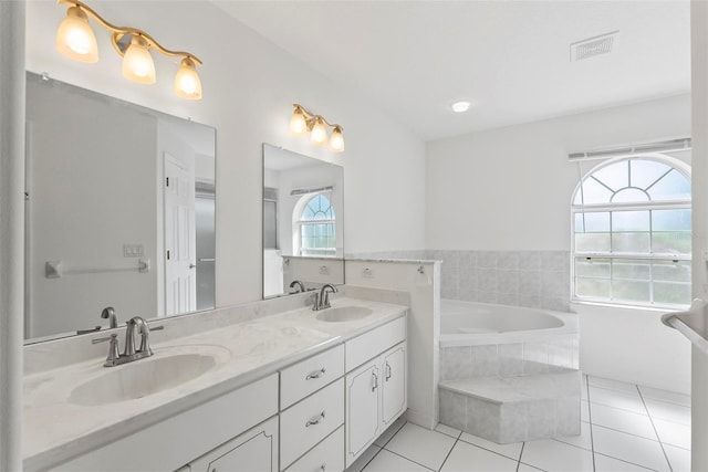 full bath with tile patterned flooring, visible vents, a sink, and double vanity