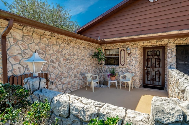 view of exterior entry with stone siding