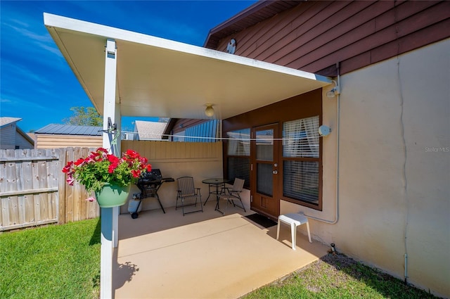 view of patio / terrace featuring fence