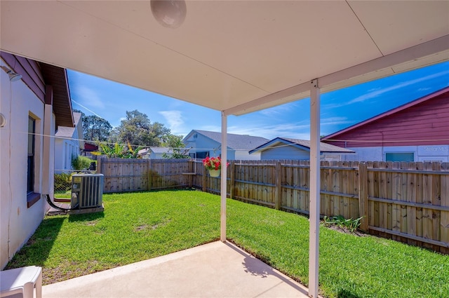 view of yard with central AC, a patio, and a fenced backyard