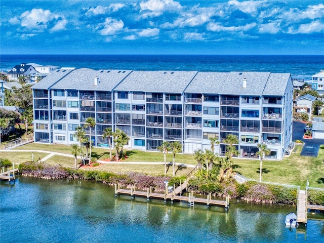 birds eye view of property featuring a water view