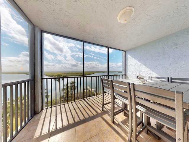 sunroom with a water view