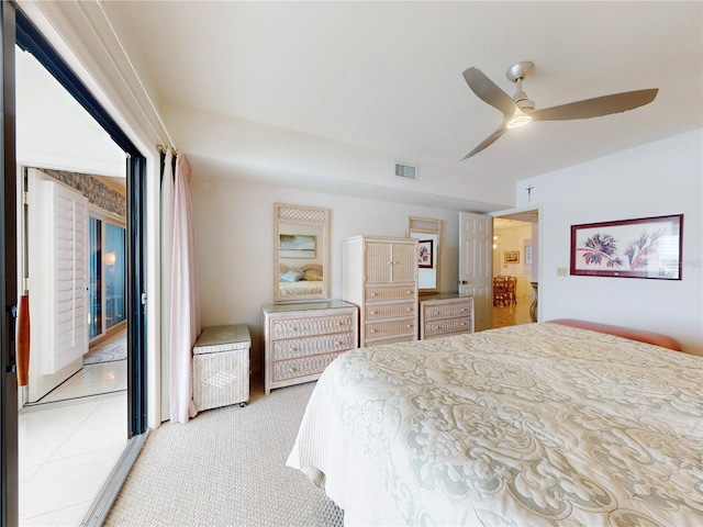 bedroom with visible vents, ceiling fan, and light carpet