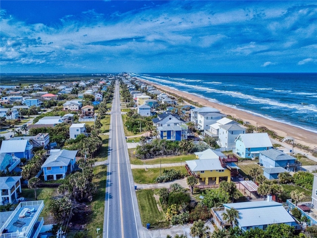 aerial view featuring a water view, a residential view, and a view of the beach