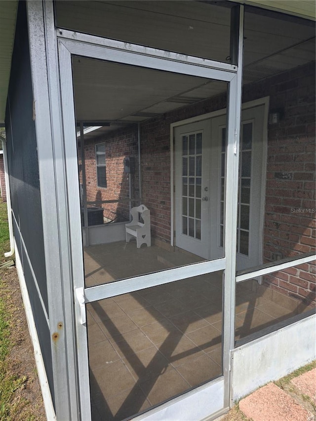 view of patio / terrace featuring a sunroom