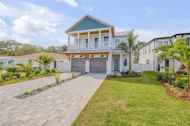 view of front of home with board and batten siding, a gate, and fence