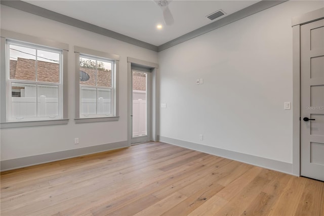 empty room featuring recessed lighting, baseboards, visible vents, and light wood finished floors