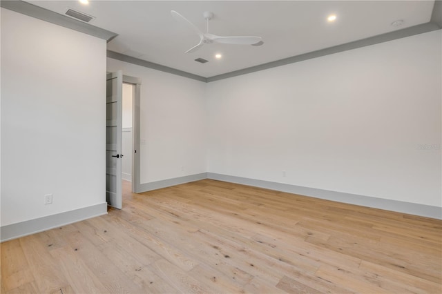 empty room with ceiling fan, light wood finished floors, visible vents, and recessed lighting