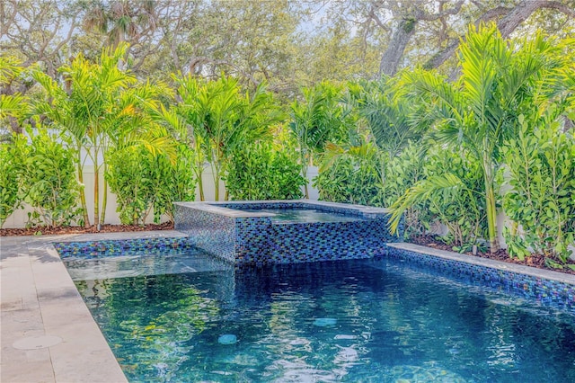 pool with an in ground hot tub