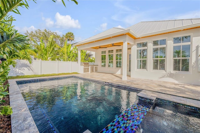 view of swimming pool featuring a patio area, ceiling fan, fence, and a fenced in pool