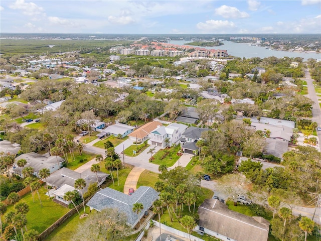 bird's eye view with a water view and a residential view