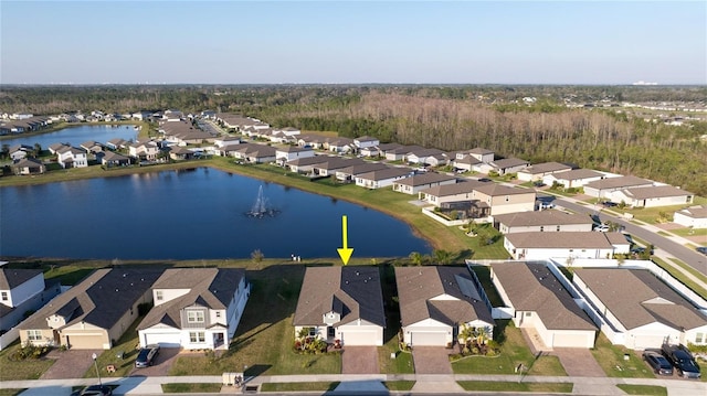 bird's eye view featuring a residential view and a water view