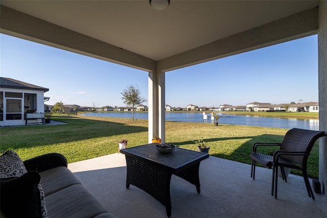 view of patio featuring a residential view and a water view