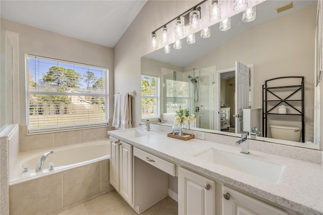 full bathroom with a garden tub, visible vents, a stall shower, vaulted ceiling, and a sink