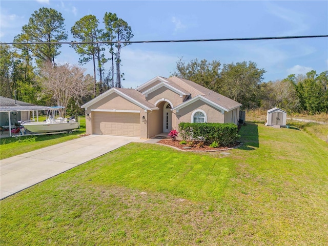 single story home with stucco siding, concrete driveway, a storage shed, an attached garage, and a front yard