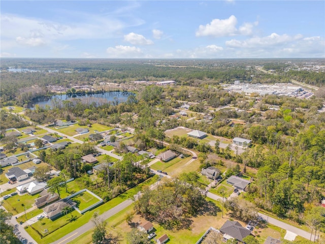 birds eye view of property with a residential view and a water view