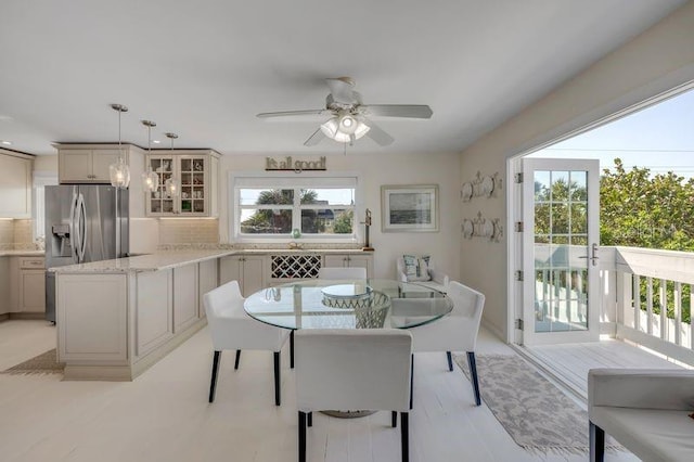 dining space with plenty of natural light and ceiling fan