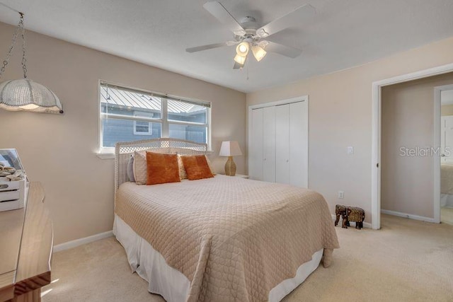 bedroom featuring ceiling fan, carpet floors, a closet, and baseboards