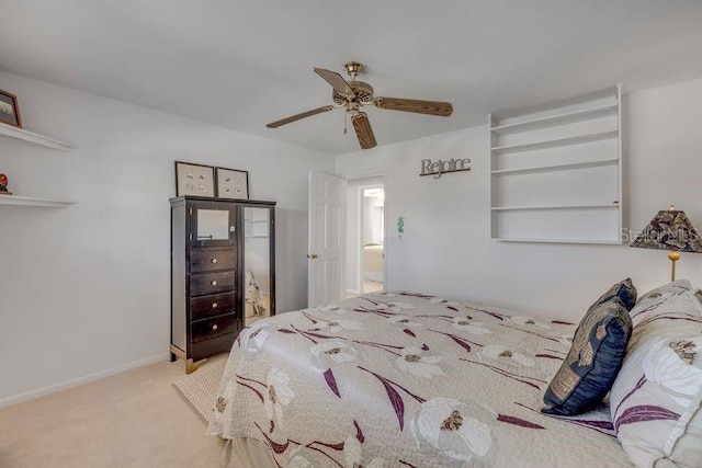 carpeted bedroom featuring a ceiling fan and baseboards