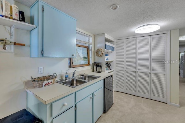 kitchen featuring open shelves, light countertops, a sink, a textured ceiling, and dishwasher