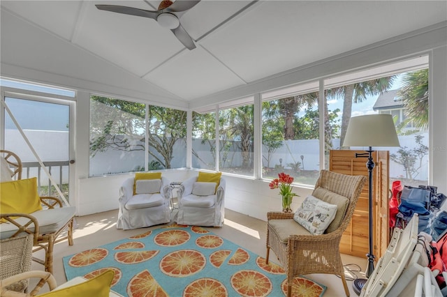 sunroom featuring a ceiling fan and vaulted ceiling