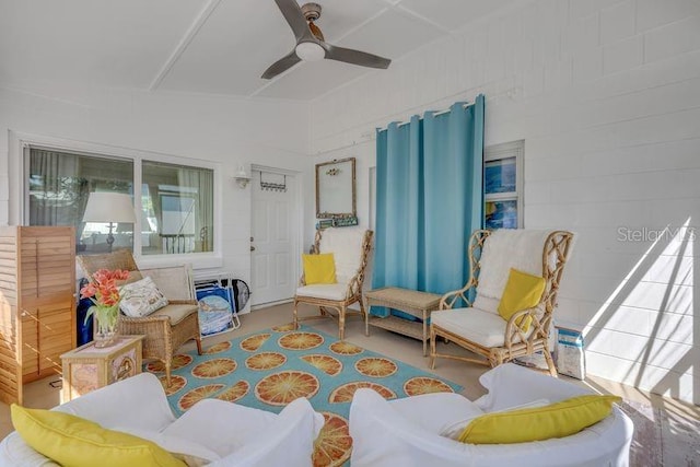 sitting room featuring ceiling fan