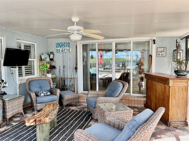 sunroom / solarium with ceiling fan