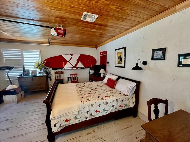 bedroom with crown molding, visible vents, a textured wall, wood finished floors, and wooden ceiling