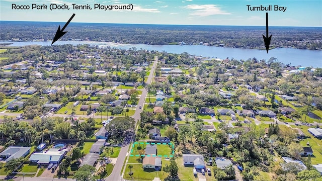 birds eye view of property with a residential view and a water view