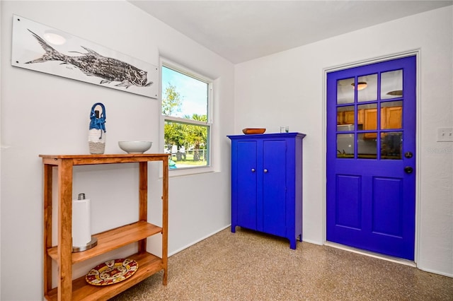 interior space featuring speckled floor