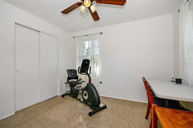 exercise area featuring a ceiling fan