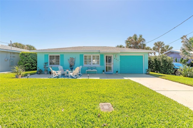 ranch-style home with concrete driveway, a patio, an attached garage, and a front yard