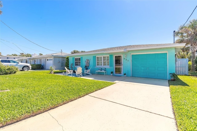 ranch-style home with a garage, concrete driveway, and a front yard