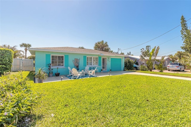 ranch-style house featuring a patio, concrete driveway, fence, a garage, and a front lawn