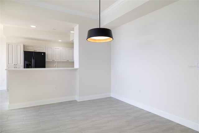 interior space featuring ornamental molding, recessed lighting, and baseboards