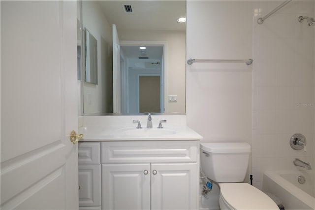 bathroom featuring toilet, bathtub / shower combination, vanity, and visible vents