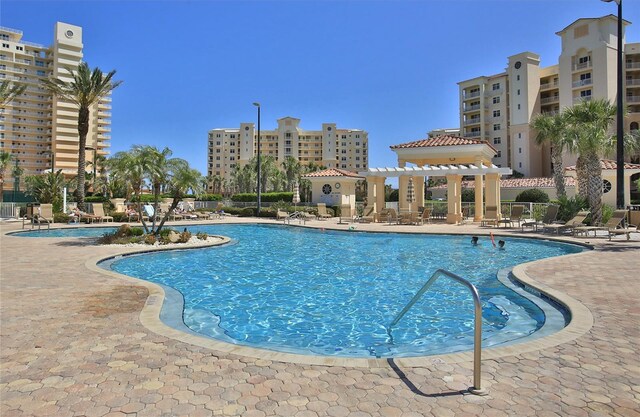 265 Minorca Beach Way Unit 505, New Smyrna Beach, FL 32169 - community pool with a patio area and a pergola