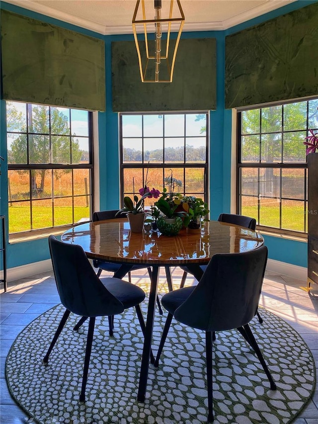 sunroom featuring an inviting chandelier