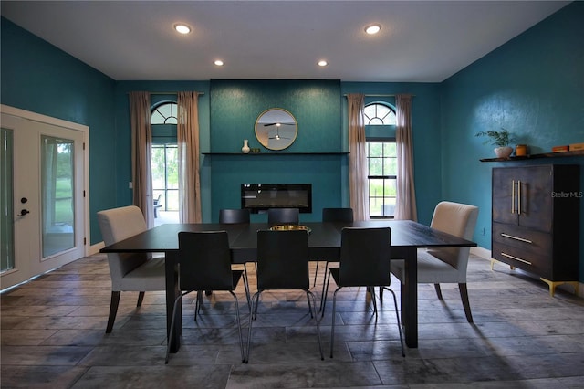 dining area with recessed lighting, baseboards, wood finished floors, and french doors