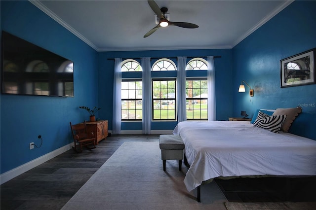 bedroom featuring a ceiling fan, baseboards, ornamental molding, and wood finished floors