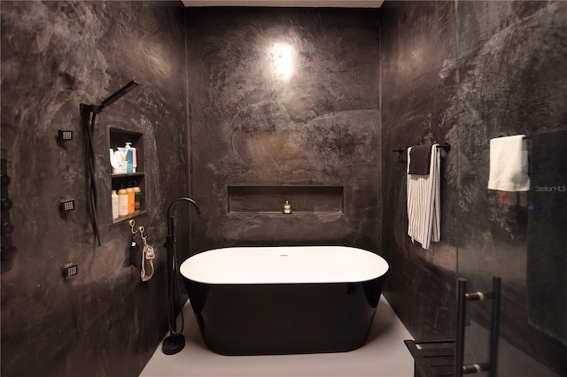 bathroom featuring a freestanding tub